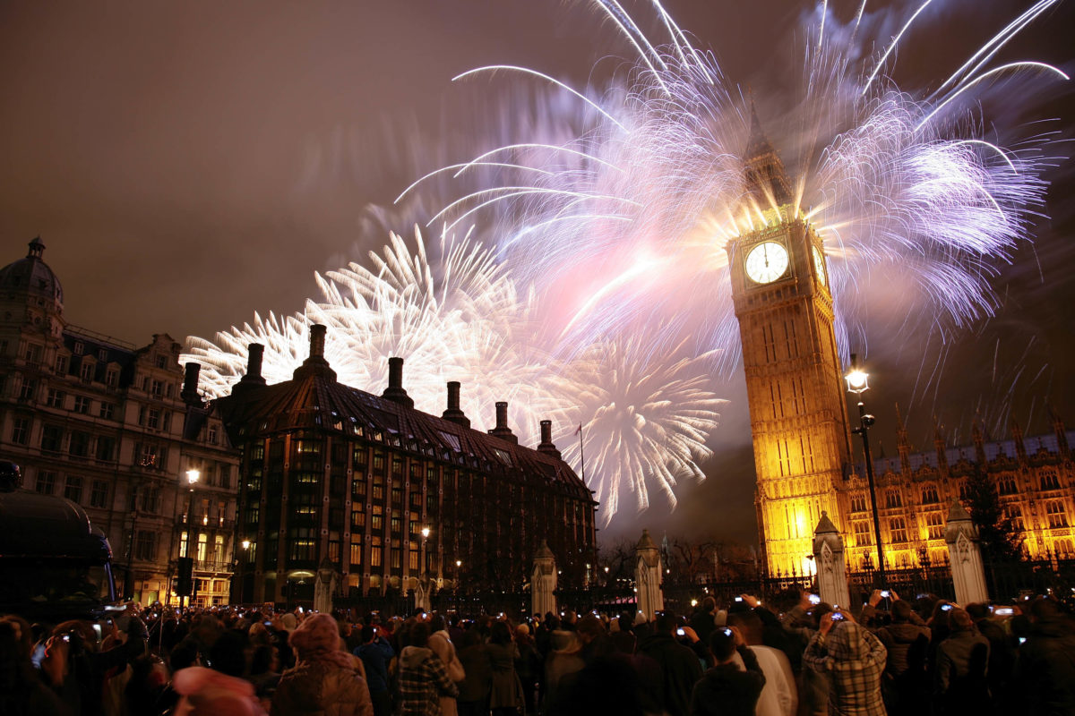 Thousands of coloured sparks rain down from Big Ben, the famous almost 100-metre-high tower at the Houses of Parliament in London on New Year's Eve, Great Britain - © Bikeworldtravel / Shutterstock